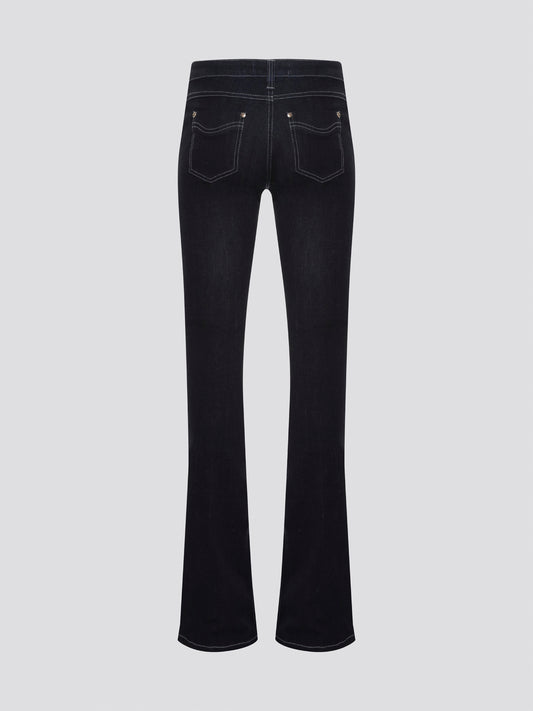 Step out in style with these Roberto Cavalli Black Contrast Stitch Flared Jeans, a modern twist on a classic silhouette. The contrast stitching adds a touch of edge to these sleek black jeans, making them a wardrobe staple for any fashion-forward individual. Pair them with a simple white t-shirt and heels for a chic and sophisticated look that will turn heads wherever you go.