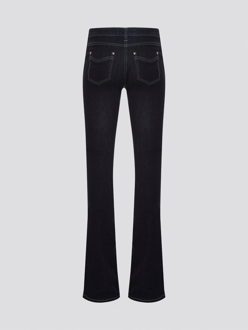 Step out in style with these Roberto Cavalli Black Contrast Stitch Flared Jeans, a modern twist on a classic silhouette. The contrast stitching adds a touch of edge to these sleek black jeans, making them a wardrobe staple for any fashion-forward individual. Pair them with a simple white t-shirt and heels for a chic and sophisticated look that will turn heads wherever you go.
