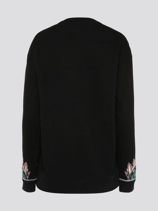 Step out in style and elevate your wardrobe with the Black Embroidered Sweatshirt from Roberto Cavalli. Featuring intricate details and luxurious craftsmanship, this sweatshirt effortlessly blends edgy street style with high-end sophistication. Make a statement and turn heads wherever you go with this must-have piece in your collection.