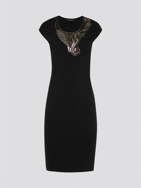 Make a bold statement in the sleek and edgy Black Studded Bodycon Dress from Roberto Cavalli. The figure-hugging silhouette is adorned with shimmering studs, creating a rockstar-worthy look that is sure to turn heads. Perfect for a night out on the town or a special event, this dress will ensure you stand out in style.