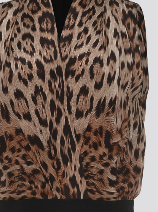 Step into the wild side with this bold and elegant Leopard Print Sleeveless Dress by Roberto Cavalli. The stunning design is perfect for making a statement at any special occasion or night out. Embrace your inner fierce and fabulous with this luxurious and eye-catching piece from one of the most renowned fashion houses in the world.