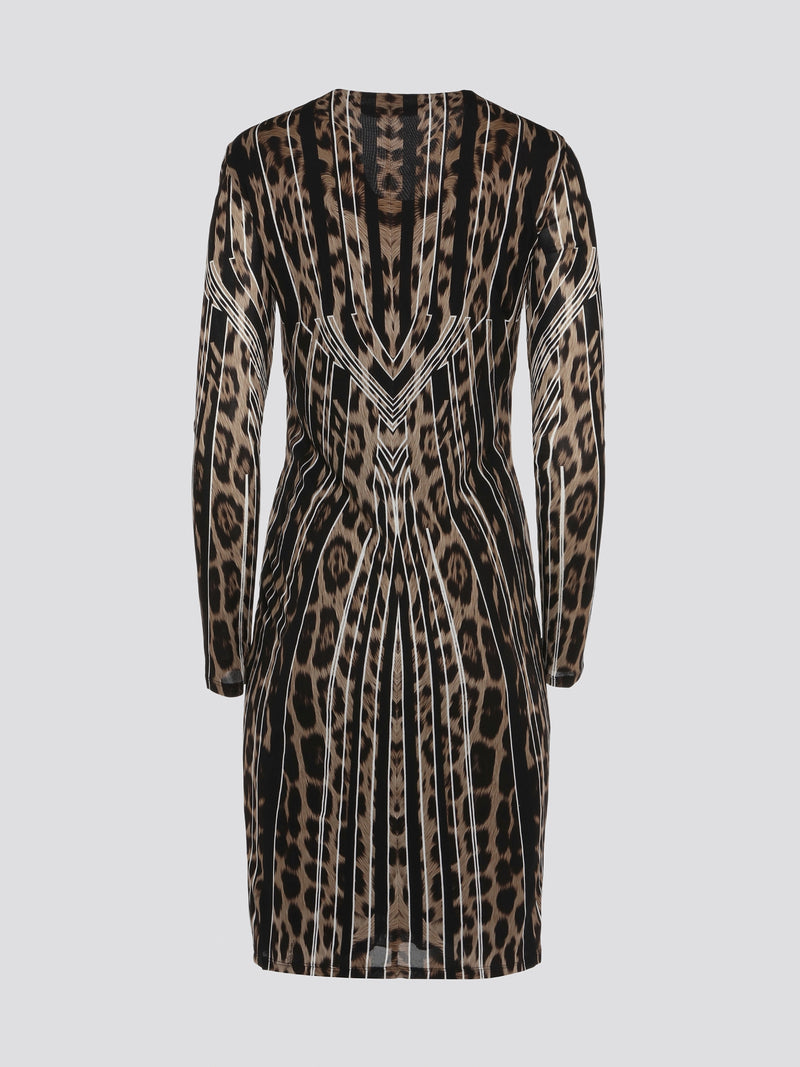 Step into the wild side with our Roberto Cavalli Leopard Print Long Sleeve Dress! This stunning statement piece features a fierce leopard print design that is sure to turn heads wherever you go. Made with high-quality materials, this dress embodies luxury and sophistication, making it the perfect choice for any stylish fashionista. Dress to impress and unleash your inner feline with this captivating Leopard Print Long Sleeve Dress from Roberto Cavalli.
