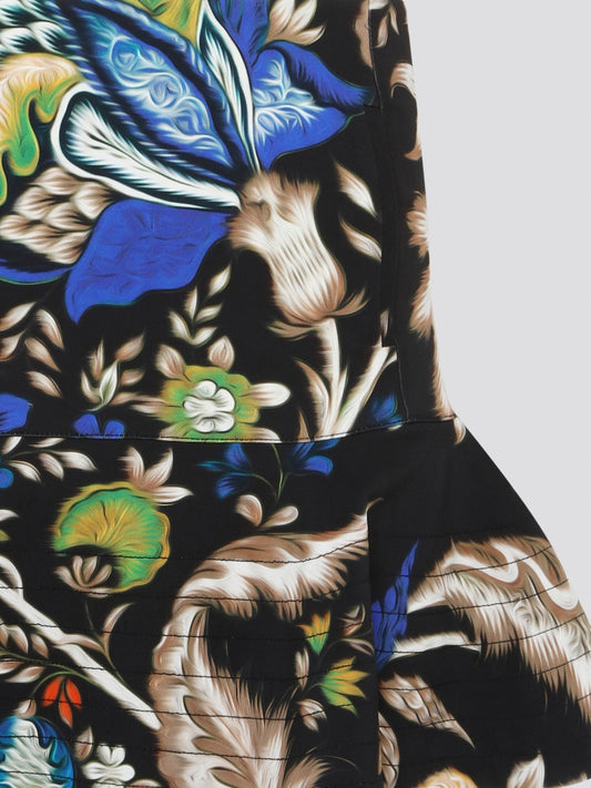 Feel fabulous and fierce in the Foliage Flared Mini Skirt by Roberto Cavalli, designed to make a statement with its bold, botanical print. This mini skirt is perfect for adding a touch of drama to your wardrobe, with its flirty flared silhouette that will have heads turning wherever you go. Embrace your inner wild side and elevate your style with this show-stopping piece from Roberto Cavalli.