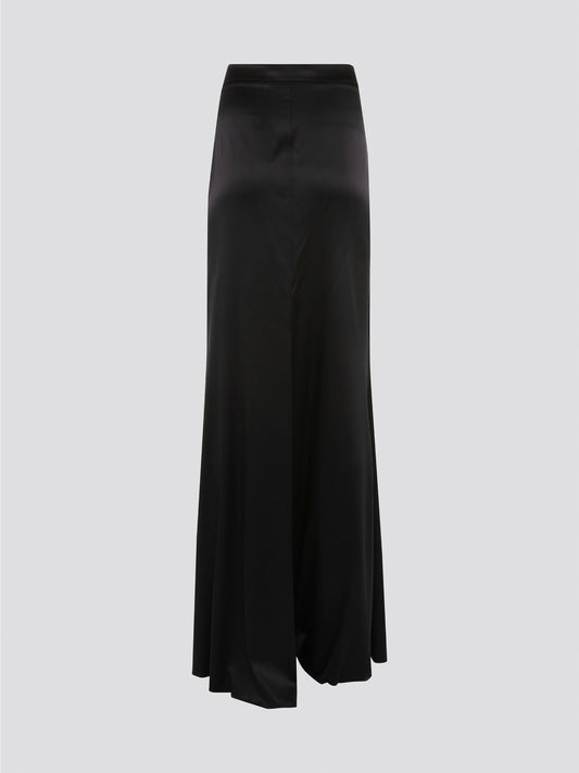 Indulge in effortless sophistication with the Black Draped Maxi Skirt by Roberto Cavalli. Made from luxurious, flowy fabric, this skirt drapes gracefully to create a flattering silhouette that exudes elegance. Whether you're heading to a black-tie event or a casual day out, this skirt will elevate your style with its timeless appeal.