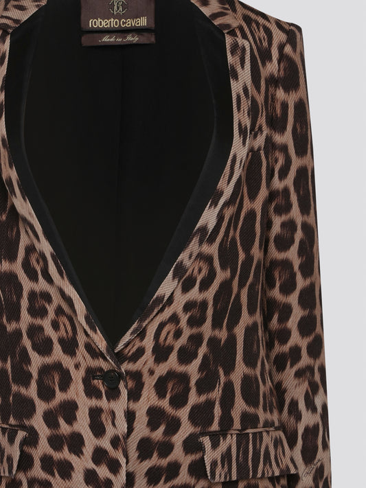 Elevate your wardrobe with the fierce and fabulous Leopard Print Blazer from Roberto Cavalli. This statement piece is perfect for adding a touch of wild sophistication to any ensemble. Embrace your inner style predator and unleash your confidence in this stunning blazer.