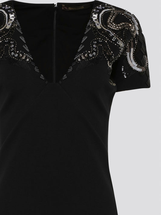 Step out in style and sophistication with our Black Embellished Plunge Dress by Roberto Cavalli. This stunning piece features intricate beadwork and shimmering embellishments that are sure to turn heads. The plunging neckline adds a touch of allure, making it the perfect choice for your next special occasion. Elevate your wardrobe with this show-stopping dress that exudes luxury and glamour.