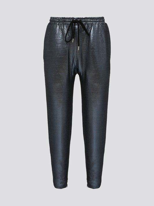 Feel your most chic and fashionable self in these stunning Blue Metallic Drawstring Pants by Markus Lupfer. The shimmering metallic finish will catch the light and turn heads wherever you go, making you the center of attention. With a comfortable drawstring waist and tapered fit, these pants are as effortless to wear as they are stylish.