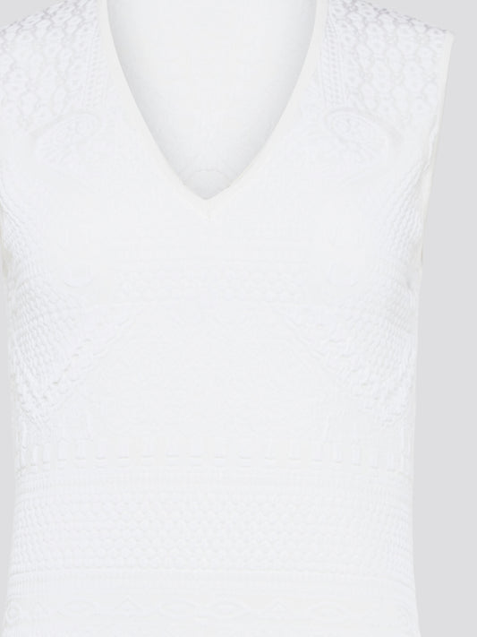 Feel effortlessly chic and sophisticated in this stunning White Sleeveless Mini Dress by Roberto Cavalli. The epitome of Italian luxury, the dress features a flattering silhouette and intricate detailing that is sure to turn heads. Perfect for any occasion, whether it's a summer soirée or a glamorous night out, this dress is a must-have for any fashion-forward woman.