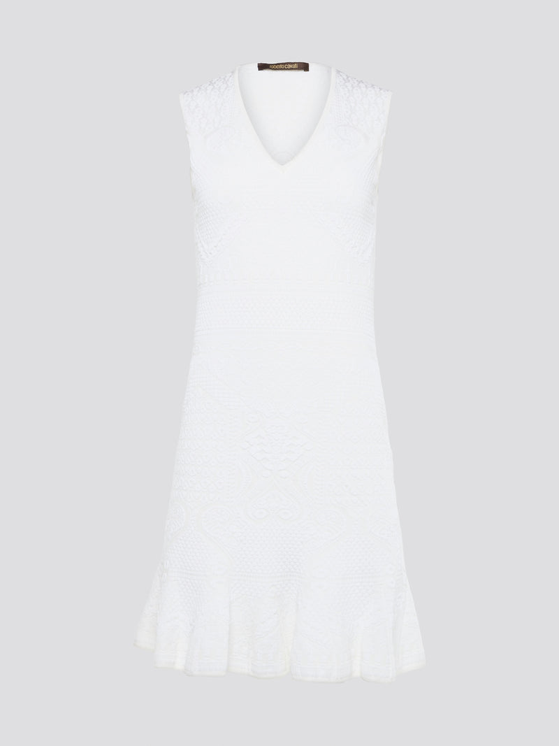 Feel effortlessly chic and sophisticated in this stunning White Sleeveless Mini Dress by Roberto Cavalli. The epitome of Italian luxury, the dress features a flattering silhouette and intricate detailing that is sure to turn heads. Perfect for any occasion, whether it's a summer soirée or a glamorous night out, this dress is a must-have for any fashion-forward woman.