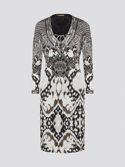 Elevate your wardrobe with this stunning Printed Long Sleeve Dress by Roberto Cavalli. The vibrant print and luxurious fabric make it a perfect choice for any special occasion or night out. Stand out in style and turn heads wherever you go in this show-stopping piece.