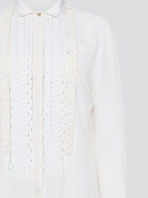 Elevate your wardrobe with this stunning Roberto Cavalli white detailed long sleeve shirt. Crafted with exquisite attention to detail, this shirt features intricate embroidery and embellishments that exude luxury and elegance. Perfect for adding a touch of sophistication to any ensemble, this statement piece is sure to turn heads wherever you go.