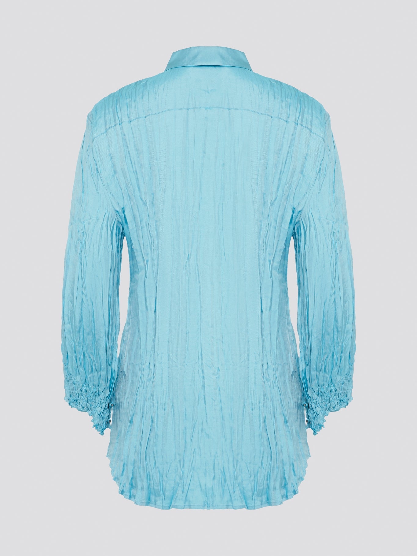 Elevate your wardrobe with the stunning Blue Crinkled Shirt from Roberto Cavalli. Crafted with meticulous attention to detail, this shirt features a unique crinkled texture that adds depth and dimension to any outfit. Whether you're dressing it up for a night out or keeping it casual for a day at the office, this shirt is sure to turn heads and make a statement.