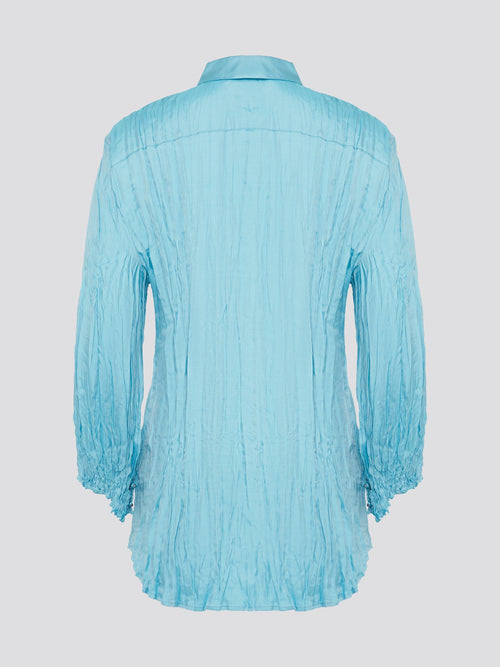 Elevate your wardrobe with the stunning Blue Crinkled Shirt from Roberto Cavalli. Crafted with meticulous attention to detail, this shirt features a unique crinkled texture that adds depth and dimension to any outfit. Whether you're dressing it up for a night out or keeping it casual for a day at the office, this shirt is sure to turn heads and make a statement.