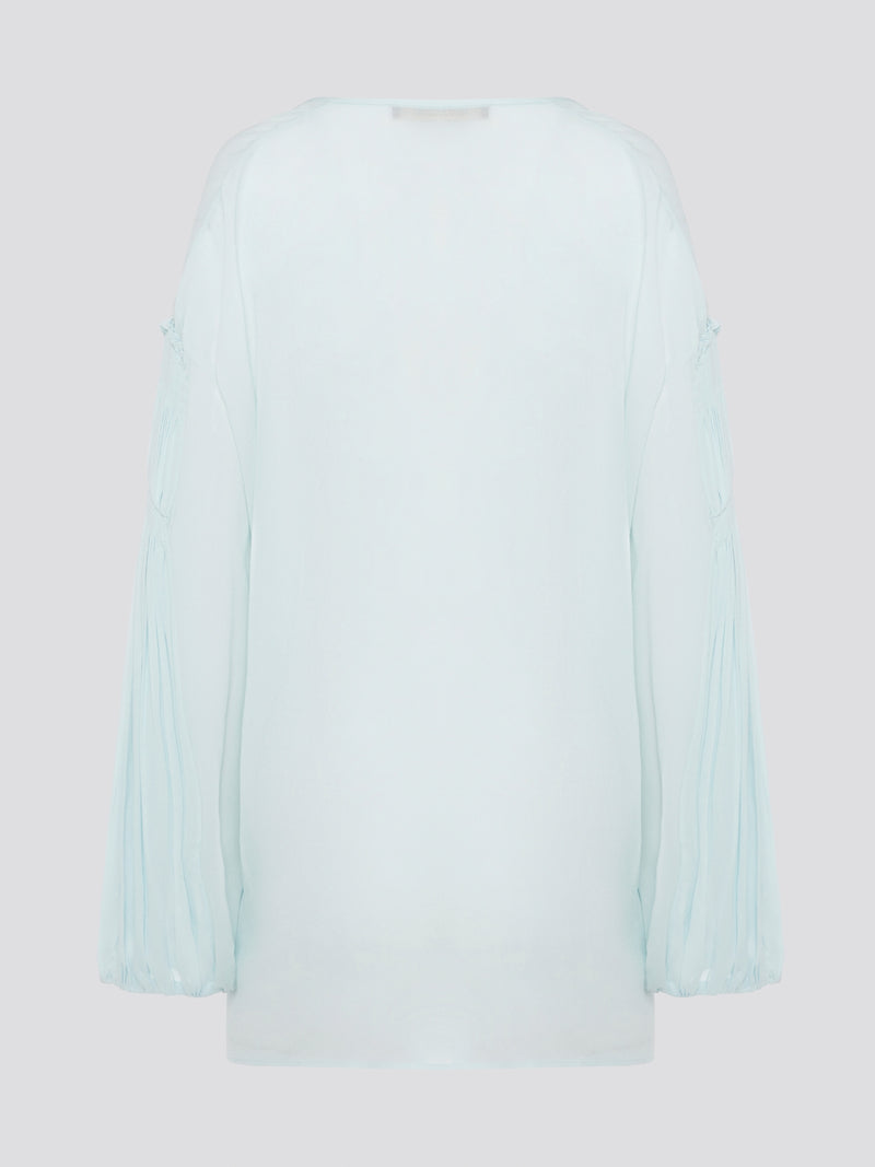 Step up your fashion game with this stunning Mint Green Tie Front Blouse by Roberto Cavalli. The delicate mint green hue and flattering tie front detail will make you stand out in any crowd. Pair it with your favorite jeans for a casual daytime look or dress it up with some sleek trousers for a night out on the town.
