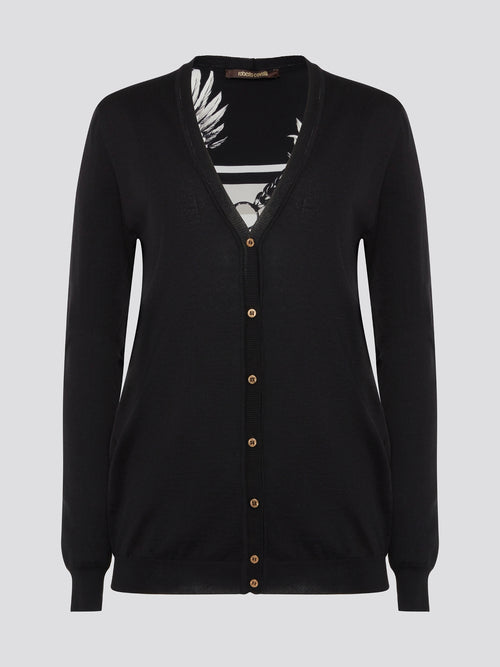 Wrap yourself in sophistication and luxury with the Black Print Panel Cardigan from Roberto Cavalli. This statement piece features a bold print design on the front panels, adding a touch of glamour to any ensemble. Whether layered over a sleek black dress or paired with jeans and a tee, this cardigan is sure to turn heads wherever you go.