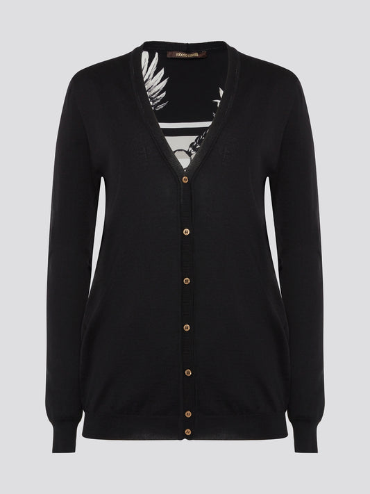 Wrap yourself in sophistication and luxury with the Black Print Panel Cardigan from Roberto Cavalli. This statement piece features a bold print design on the front panels, adding a touch of glamour to any ensemble. Whether layered over a sleek black dress or paired with jeans and a tee, this cardigan is sure to turn heads wherever you go.