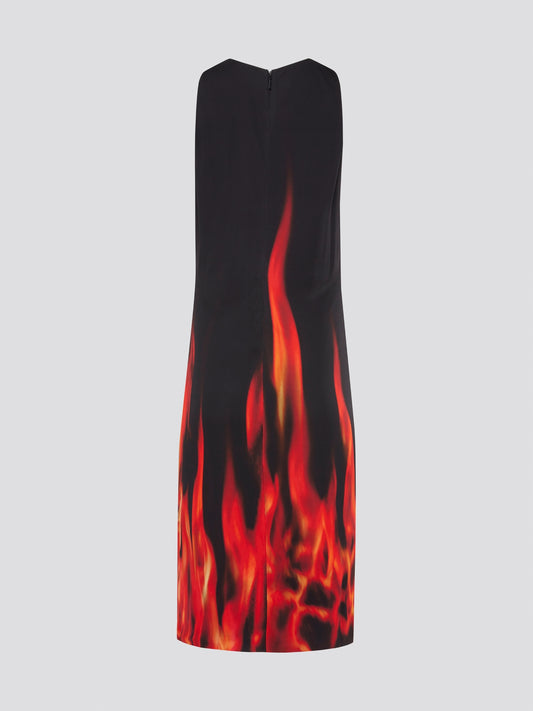 Set the night on fire with this striking Black Flame Print Keyhole Dress by Roberto Cavalli. The bold flame design on the sleek black fabric brings a fierce energy to any occasion. The seductive keyhole neckline adds a touch of mystery to this show-stopping statement piece.