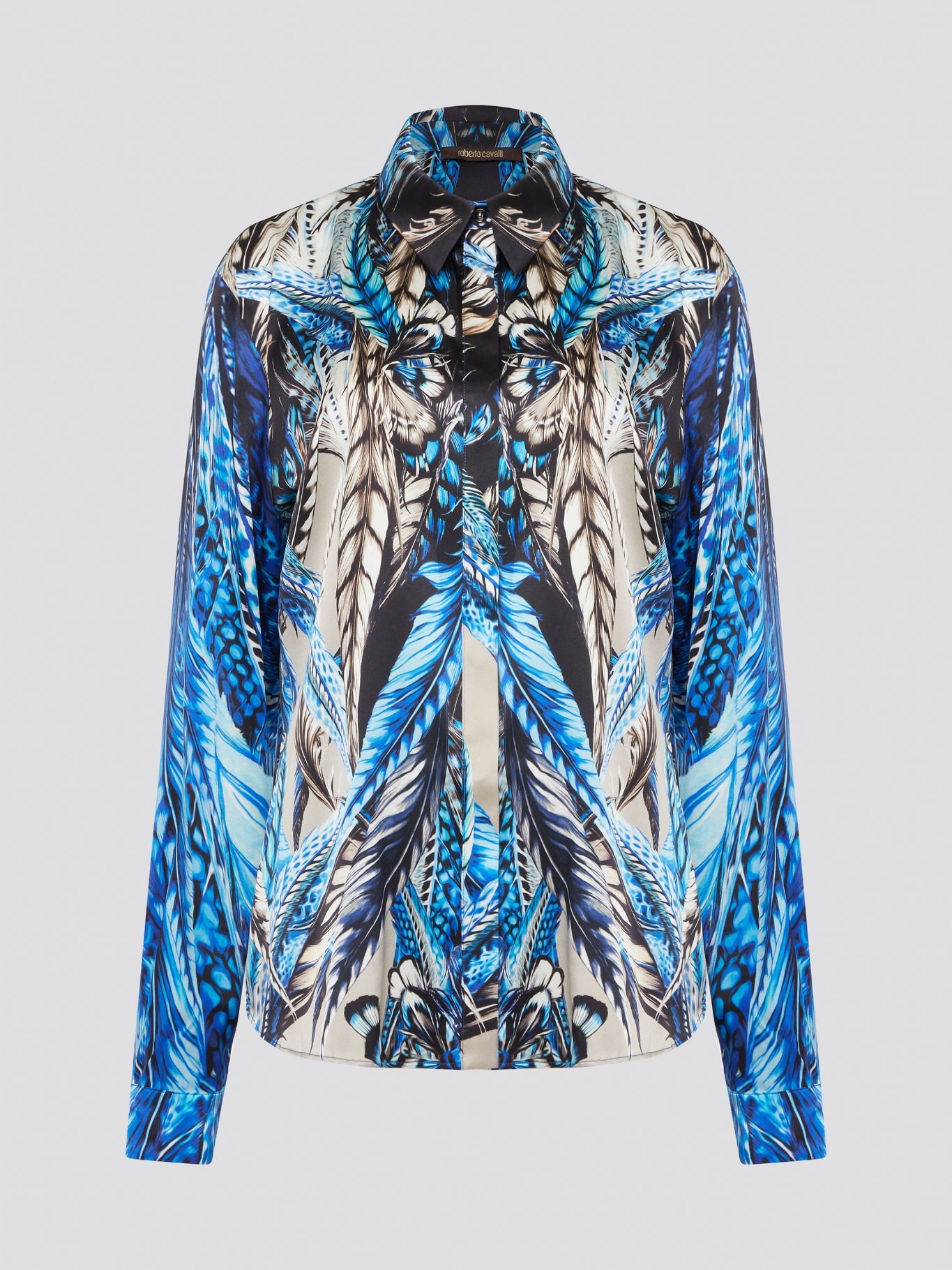 Elevate your wardrobe with the stunning Blue Printed Long Sleeve Blouse by Roberto Cavalli. Featuring a bold and striking print, this blouse is perfect for making a statement wherever you go. Crafted with exquisite attention to detail, this piece will add a touch of luxury and sophistication to any outfit.