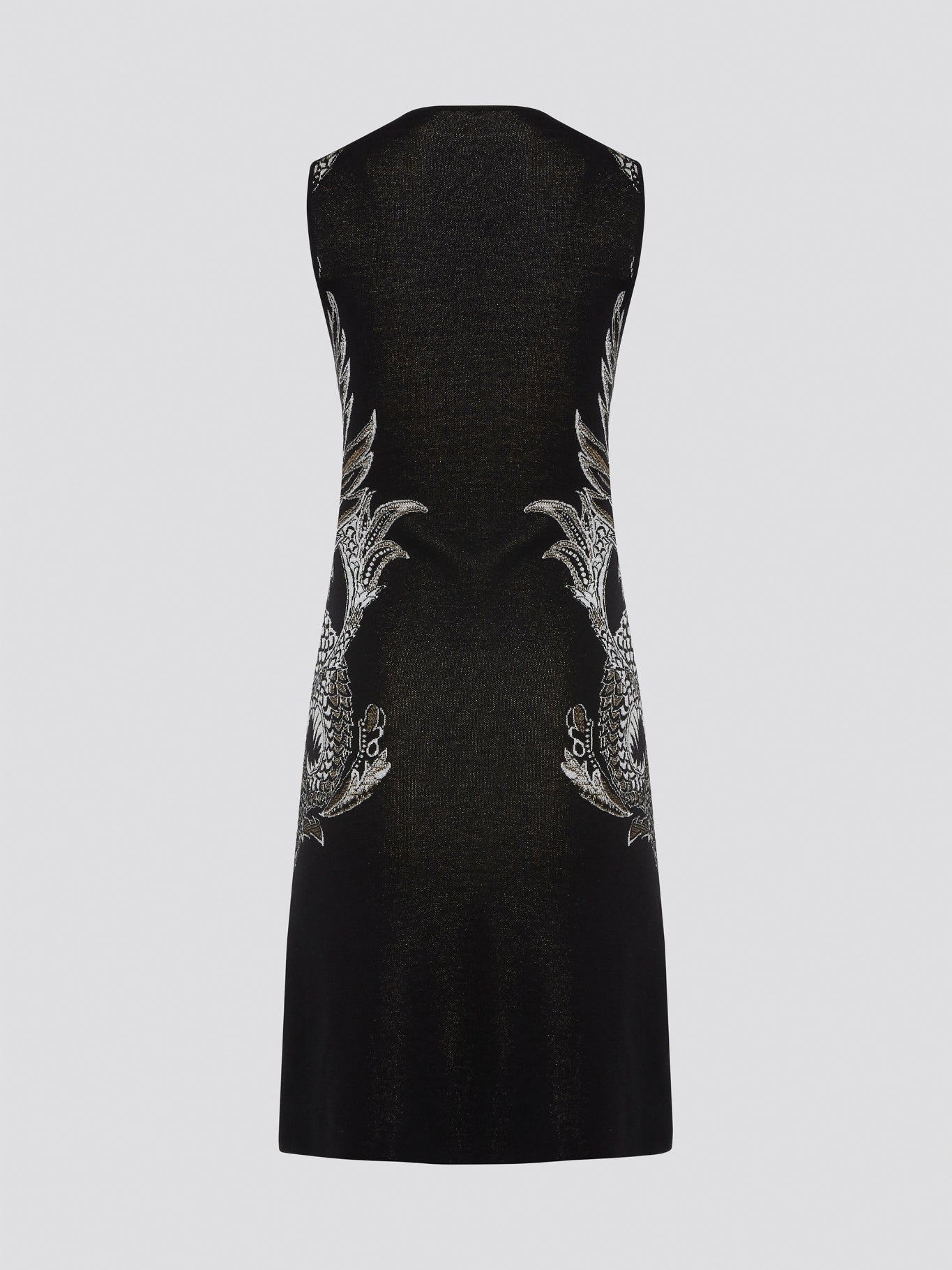 Elevate your wardrobe with the exquisite Knitted Bodycon Dress by Roberto Cavalli. Crafted with precision and care, this dress features intricate knitted details that hug your curves in all the right places. Make a statement at any event with this luxurious and unique piece that exudes elegance and style.
