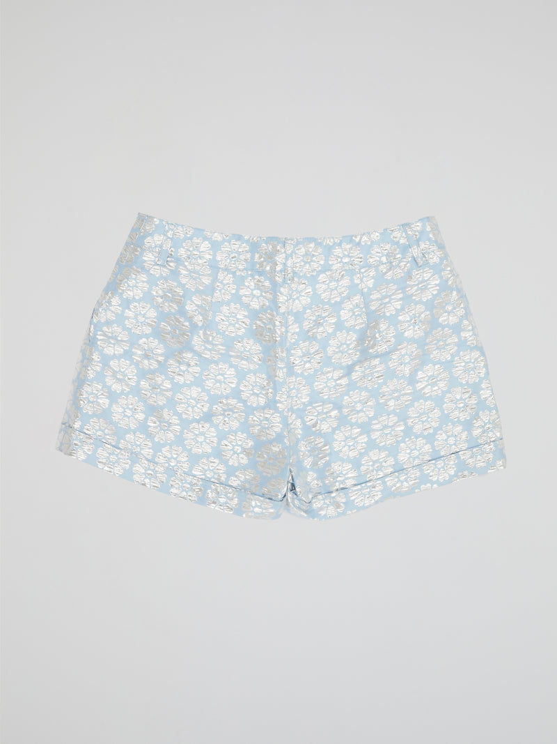 Transport yourself to a whimsical garden with these Blue Floral Print Shorts by Parosh. Made from luxurious fabric, these shorts feature a vibrant blue hue adorned with intricate floral designs for a statement-making look. Perfect for exploring the city or lounging in the sun, these shorts are a must-have addition to your wardrobe.
