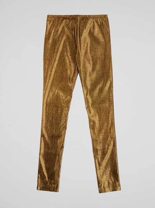 Step up your fashion game with these Roberto Cavalli Gold Elasticated Waist Trousers. The shimmering gold fabric and elasticated waist ensure both style and comfort, making them perfect for a night out or special occasion. Channel your inner glam and stand out from the crowd with these luxurious trousers.