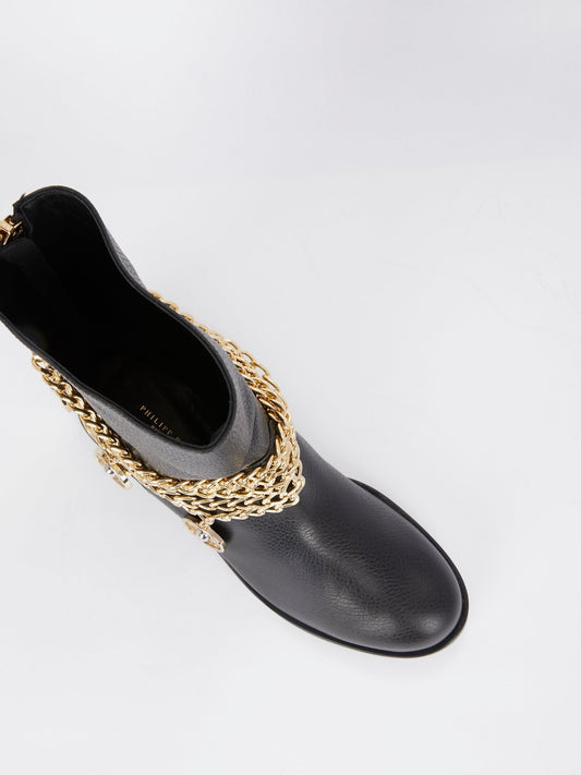 Черные кожаные ботинки с золотыми цепями
