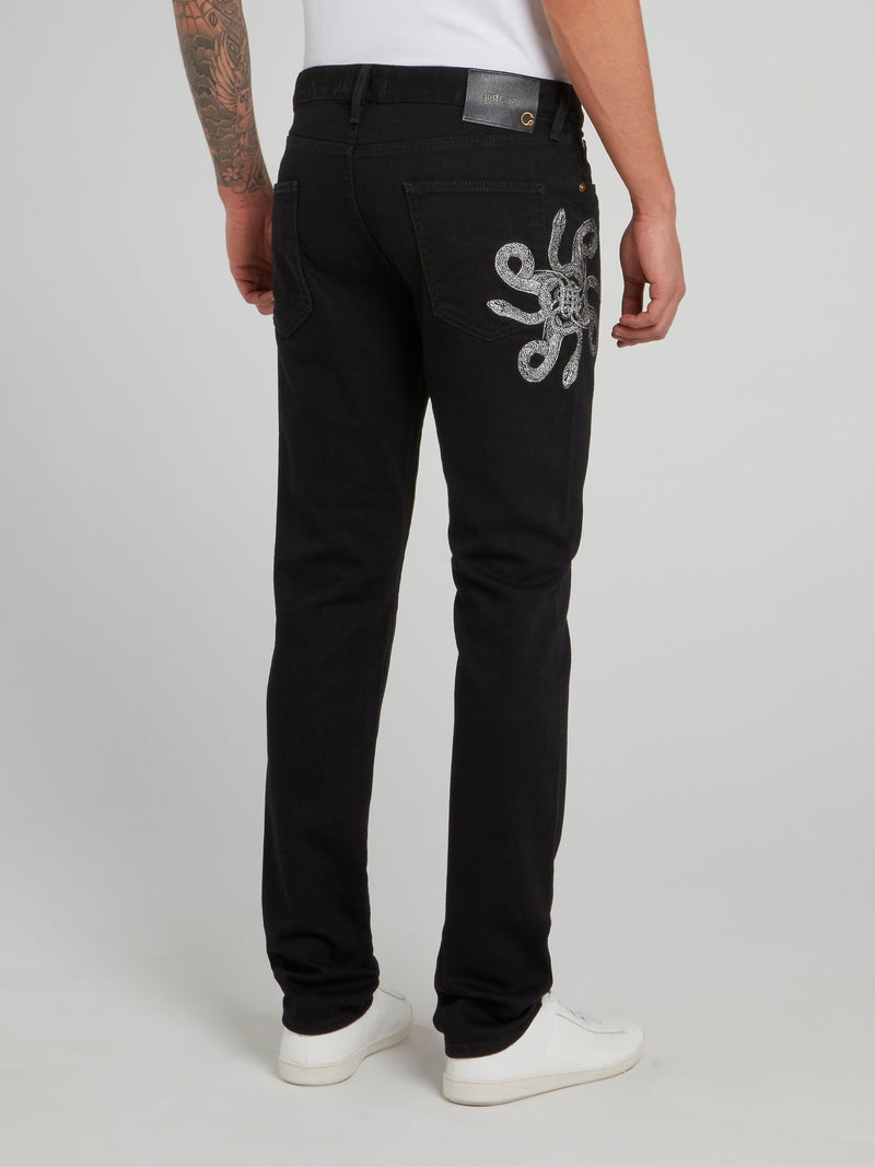 Черные прямые джинсы с изображением змеи