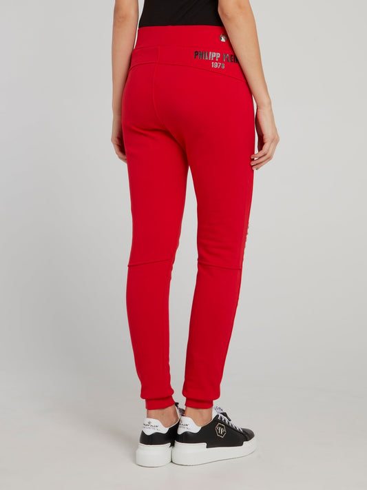 Красные спортивные брюки на резинке с декором в виде цепочек