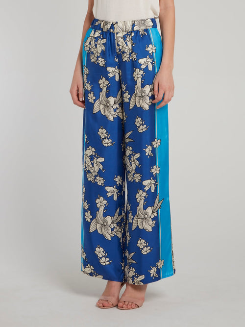 Синие брюки палаццо из шелка с цветочным принтом