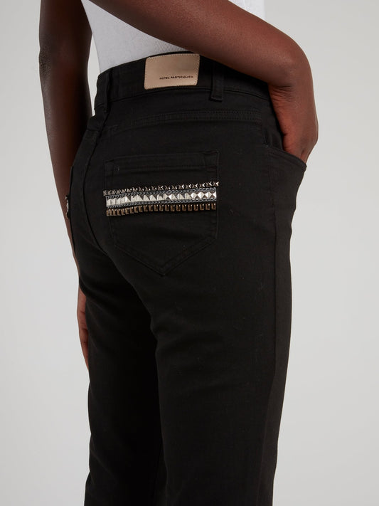 Черные брюки с декором на карманах