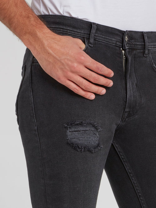 Черные джинсы скинни с рваной отделкой
