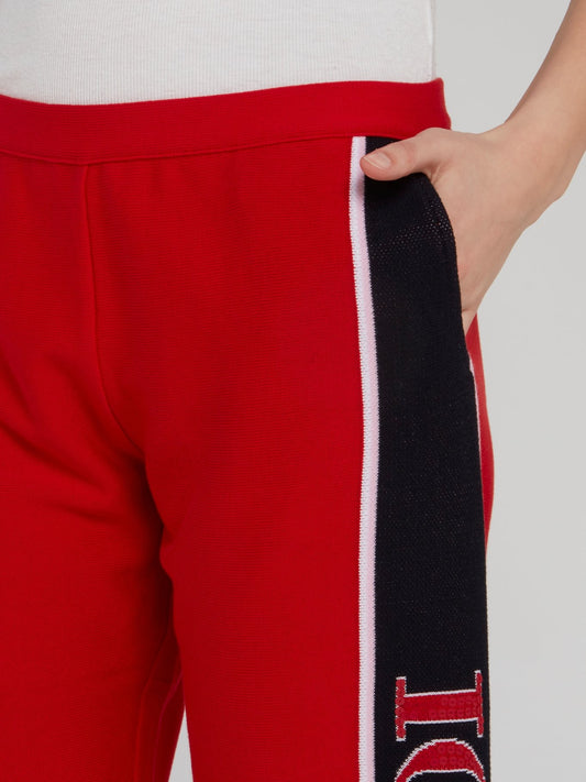 Красные трикотажные брюки с логотипом на лампасах