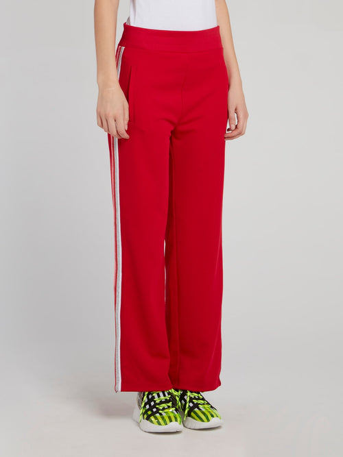 Красные расклешенные брюки с лампасами