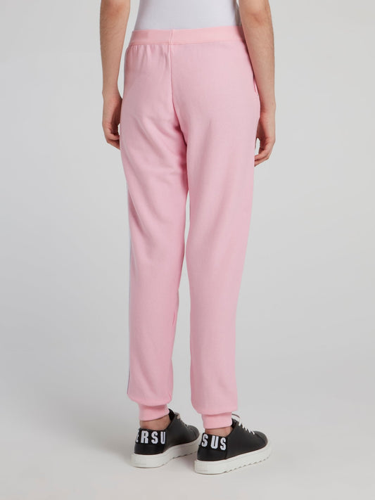 Розовые спортивные брюки с логотипом
