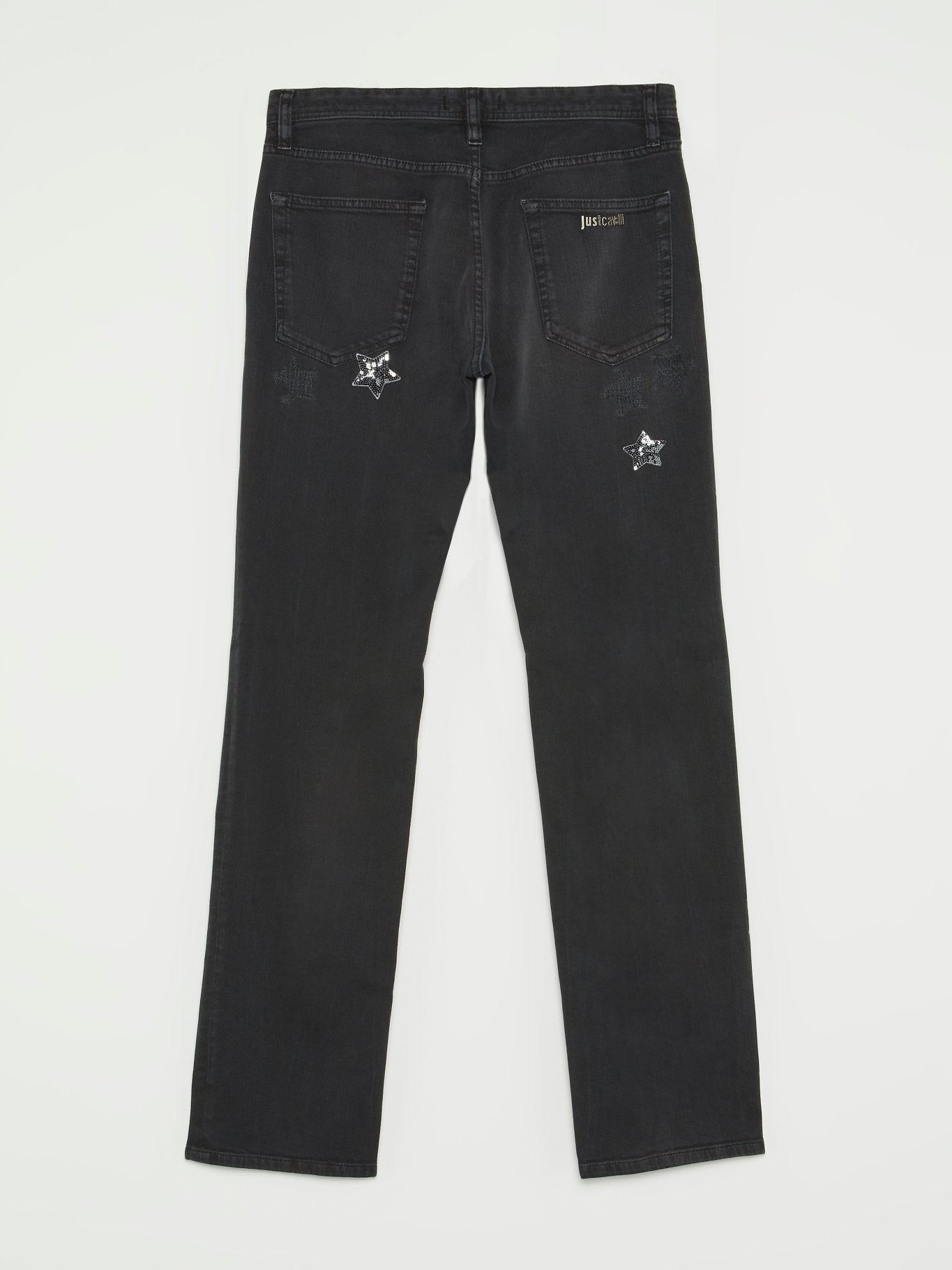Черные брюки со звездами из пайеток