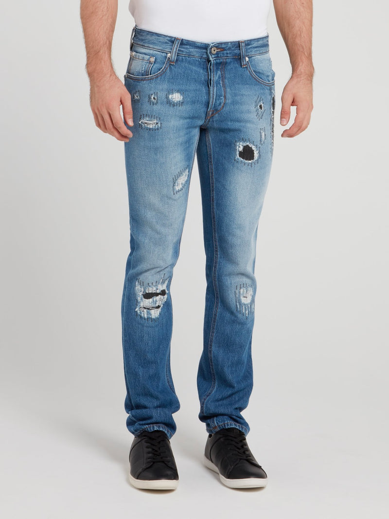 Синие джинсы с рваной отделкой